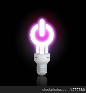 Energy saving concept. Power concept with light bulb glowing on dark background