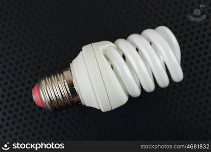 energy saving lamp on a dark background