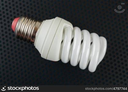 energy saving lamp on a dark background