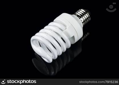 energy smart spiral light bulb isolated on black background