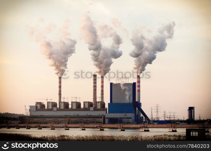 Energy. Smoke from chimney of power plant or station. Industrial landscape.