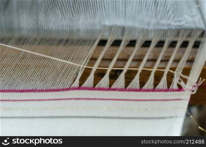 Engaged in production of handicraft textiles on the loom