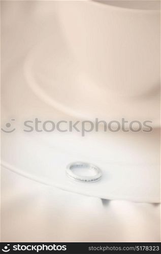 Engagement ring on a coffee saucer. Wedding proposal