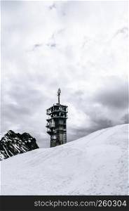 Engelberg, Switzerland - Snow plain with Titlis Cliff walk tower at glacier park on Titlis mountain peak , famous tourist attraction on Swiss alps.
