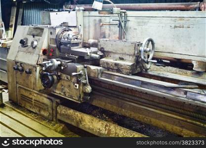Engine metal lathe machine in turnery workshop