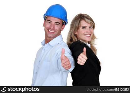 Engineer and a tradesman giving the thumb&rsquo;s up