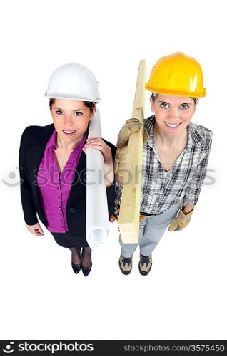 Engineer and construction worker side-by-side