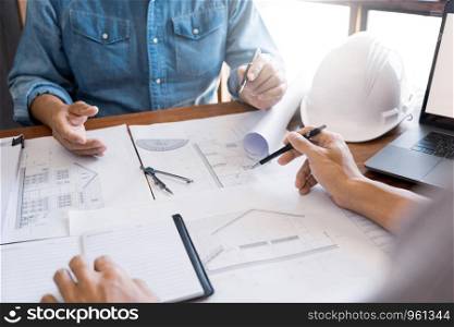 Engineer architect design team colleagues working office discussing meeting discussion construction project concept