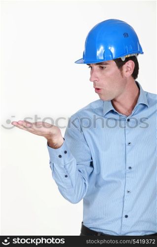 Engineer blowing an invisible object