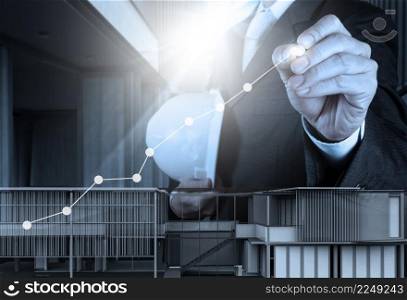 engineer businessman hand draws business success chart concept on virtual screen