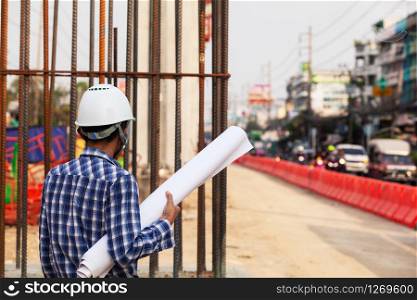 engineer checking progress of construction site,engineer working on checking progress of construction site