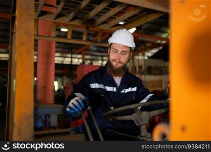 Engineer checks the operation of the forklift truck after the repair is completed.