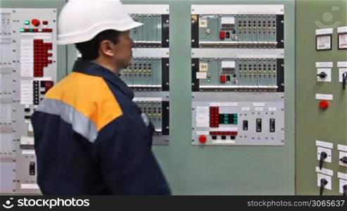 engineer comes and presses button check light indication on panel control of gas in premises
