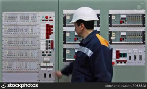 engineer comes to checking light indication on two control panels