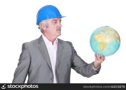 Engineer holding a globe