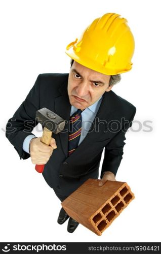 engineer holding a hammer and a brick, isolated on white