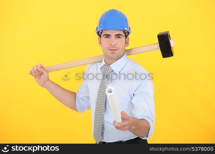 Engineer holding a rolled-up blueprint