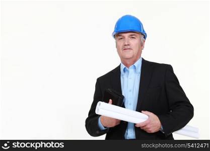 Engineer holding a rolled-up blueprint and an agenda