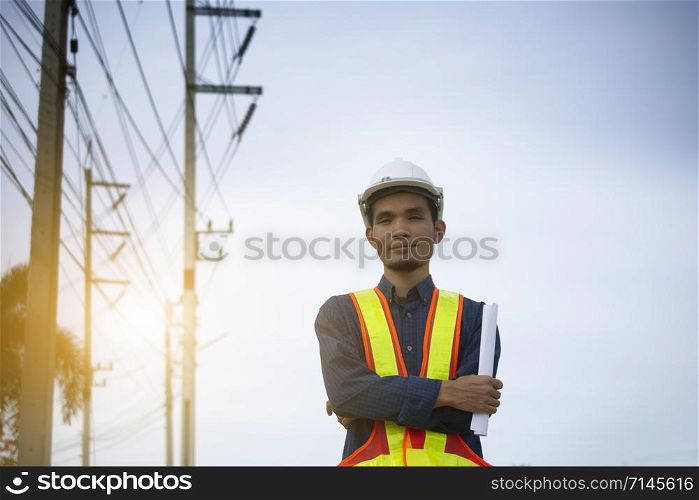 Engineer holding paper plan work electrician power