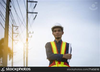Engineer holding paper plan work electrician power