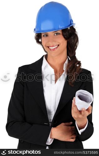Engineer holding rolled up plans