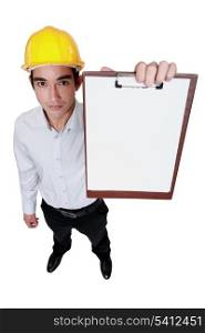 Engineer holding up a blank clipboard