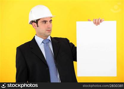 Engineer holding up a blank sign