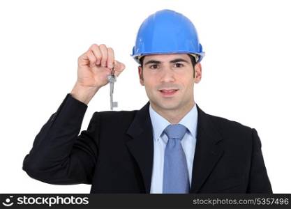 Engineer holding up a key