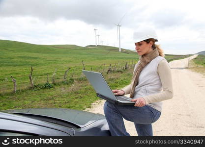 Engineer in wind turbines field using electronic tablet