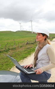 Engineer in wind turbines field using electronic tablet