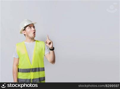 Engineer man pointing up. Surprised face engineer pointing finger to the right, Surprised engineer pointing to the side, Surprised face construction worker pointing at an advertisement
