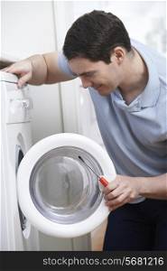Engineer Mending Domestic Washing Machine