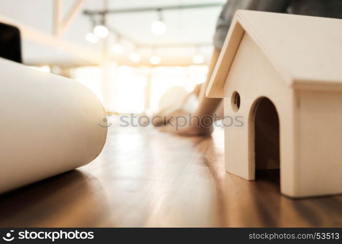 Engineer of architect starting draw a house blueprint on the desk in the office at construction working site and Engineering tools.