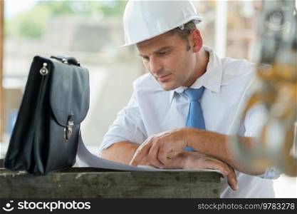 engineer or architect sitting working at his desk