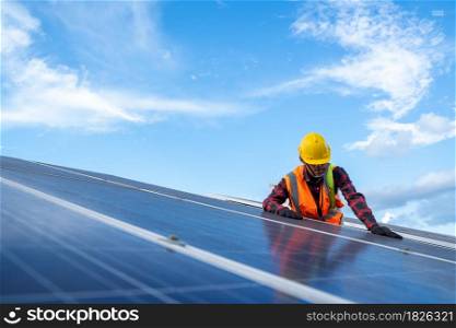 Engineer or electrician checking and maintenance on replacement solar panel at solar power plant,Green energy and sustainable development for solar energy power generator.