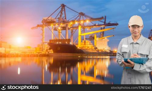 Engineer or technician write book with cargo port shipping background