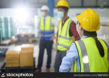 Engineer people are wearing protective mask working in warehouse