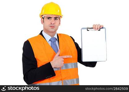 Engineer pointing to a clipboard