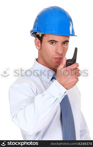 Engineer speaking into his walkie-talkie