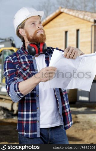 engineer standing with builder outdoors