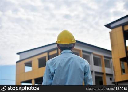Engineer standing worker building estate construction background