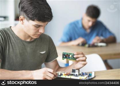 engineer student learning fix electronic component computer motherboard