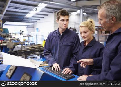 Engineer Teaching Apprentices To Use Tube Bending Machine