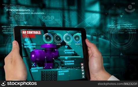 Engineer use augmented reality software in smart factory production line with automated application . Futuristic machinery in working in concept of Industry 4.0 or 4th industrial revolution.