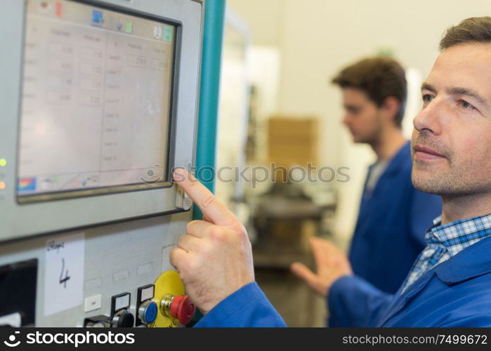 Engineer using touchscreen controls
