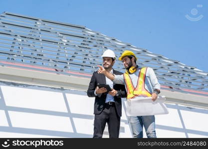 Engineer with business manager are talking in construction site,Project owner with blueprint working to new residential home building work site.