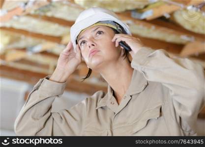 engineer woman with safety helmet talking on phone