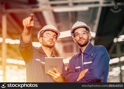 Engineer worker friend people team working discussion help support together at work in heavy industry factory.