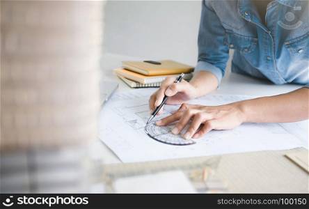 engineer working on blueprint with tools - interior architect concept