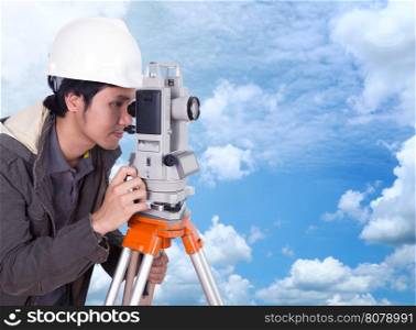 engineer working with survey equipment theodolite with blue sky background